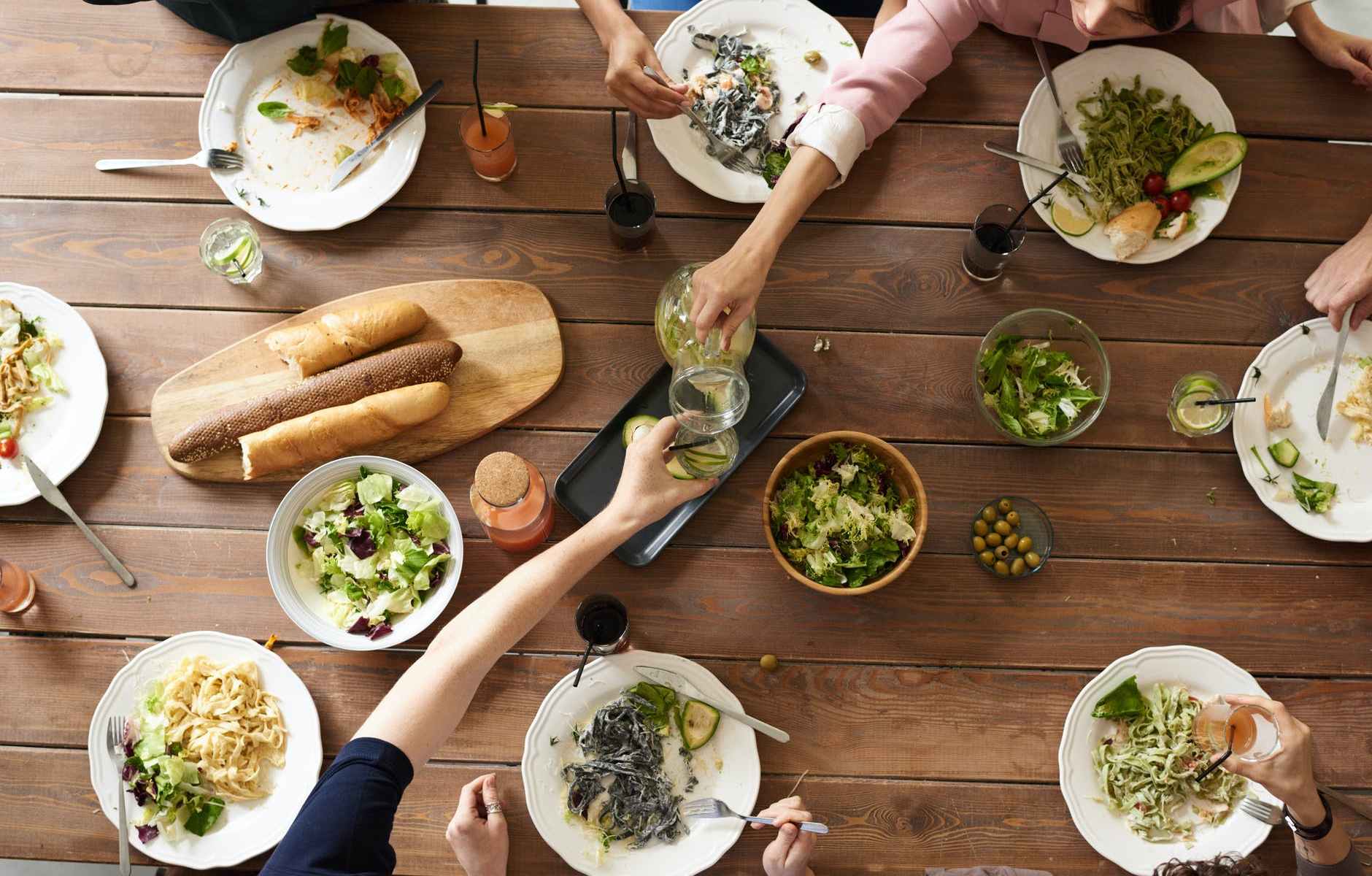 woman pouring juice on glass